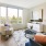 spacious and well lit living room with large window