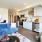 natural, bright lighting fills living room and kitchen