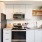 open kitchen wall with stainless steel appliances