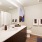 bathroom with ample lighting and shower/tub combo