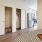 studio bedroom across closets and kitchen
