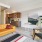 roomy living area with bedroom and kitchen access