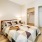 well lit bedroom with two closets